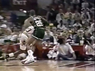 Michael Jordan being tackled by the Milwaukee Bucks.