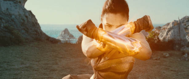 Wonder Woman crossing her gauntlets.