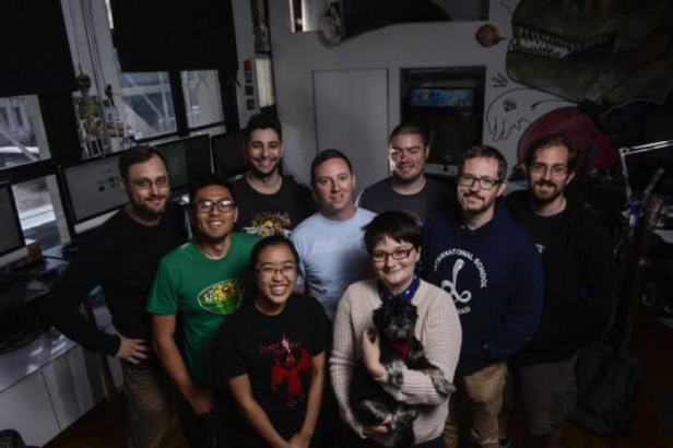 A group of people standing together posing for a picture.