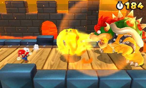 Mario avoiding a fireball from Bowser.